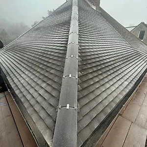 A view of a roof from the top of a building.
