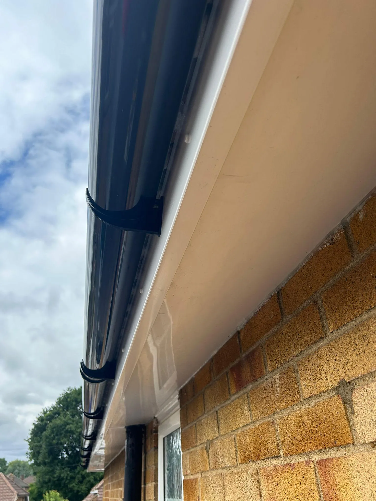 brown bricks with white top and black gutter